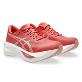 Women's ASICS Sonicblast tempo trainers in dark pink and clay with white accents, featuring breathable mesh and supportive design.