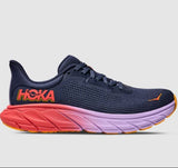 Women's Hoka Arahi 7 B-width running shoes in varsity colorway featuring a supportive athletic design and cushioned sole.