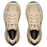 Women's Hoka Challenger 8 wide running shoes in faded navy with barley flour accents, featuring a breathable mesh upper and cushioned sole.
