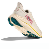 Women's Hoka Clifton 10 shoes in birch and alabaster, showcasing the lightweight running shoe with breathable fabric and supportive sole.
