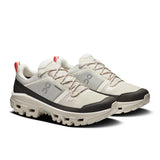 Men's On Cloudrock Low Waterproof hiking shoes, lightweight and durable outdoor footwear, shown in a natural outdoor setting.