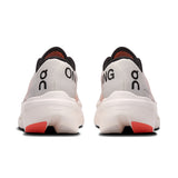 On Cloudboom Volt women's road running shoes in black and teal with cushioned soles and breathable mesh upper.