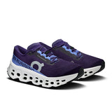 On Cloudmonster 3 women's road running shoes in black and pink, featuring breathable mesh and cushioned soles for comfort.