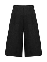 Men's high-waisted pleated wide-leg capri pants by Trendsi, showcasing the relaxed fit and stylish design in a natural stance.