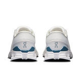 On Cloud X 4 men's training shoes in ivory and steel, showcasing lightweight athletic design with breathable mesh and cushioned soles.