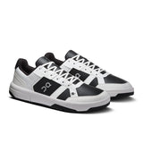 Men's On THE ROGER Clubhouse tennis shoes with a sleek design and white and blue color scheme, perfect for on-court performance.
