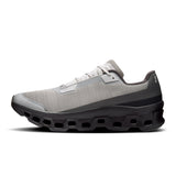 Men's On Cloudmonster Void active life sneakers in black with orange accents, showing the lightweight design and cloud cushioning.