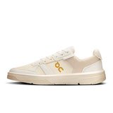 On THE ROGER Clubhouse Ace men's tennis shoes with white and blue design, featuring cushioned soles and breathable mesh upper.