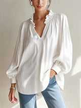 Trendsi frill notched long sleeve blouse with ruffled collar and button details, shown in a close-up image.