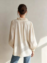 Trendsi frill notched long sleeve blouse with ruffle details, lightweight fabric, and classic collar, stylish for casual or office wear.
