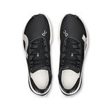 Men's On Cloudboom Strike road running shoes in black with white accents, featuring sleek design and supportive cushioning.