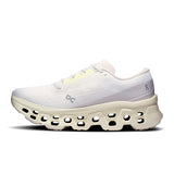 Women's On Cloudmonster 3 road running shoes with breathable mesh uppers and cushioned soles, designed for comfort and performance.