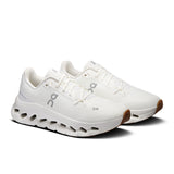 Women's On Cloudtilt active lifestyle shoes in black and pink with breathable mesh and cushioned soles for comfort and support.