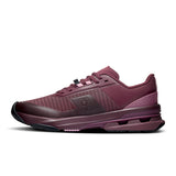 Women's On Cloudpulse Pro training shoes in black and white with cushioned soles and breathable mesh uppers.