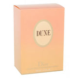 Christian Dior Dune Eau de Toilette women's fragrance bottle with 3.4 fl oz (100ml) on a neutral background.