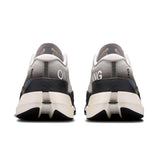 On Cloudboom Max men's road running shoes in black with blue accents, featuring a sleek design and cushioned soles for comfort.