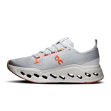 On Cloudsurfer Max men's running shoes in limited edition Glacier and Flame colors, featuring sporty design and cushioned soles.