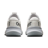 On THE ROGER Pro 3 women's tennis shoes in white with black accents, featuring sleek design and supportive athletic construction.