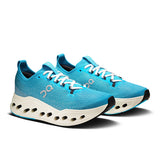 Women's On Cloudsurfer Max road running shoes in black and white with cushioned soles and breathable mesh upper.