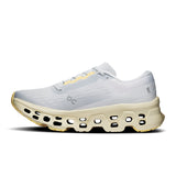 Women's On Cloudmonster 3 road running shoes with breathable mesh upper and cushioned sole, designed for comfort and performance.