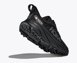 Women's Hoka Challenger ATR 7 GTX trail running shoes in tan with B-width, featuring durable design and rugged outsole for outdoor adventures.