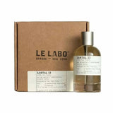 Le Labo Santal 33 Eau de Parfum spray in 100ml bottle, showcasing elegant packaging and the fragrance bottle.