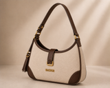 Cream and brown two-tone shoulder bag by Bagsor with tassel detail, featuring a stylish design and adjustable strap.