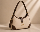 Cream and brown two-tone shoulder bag with tassel detail from Bagsor, featuring a stylish design and adjustable strap.