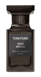 Tom Ford Oud Wood unisex Eau de Parfum bottle with black cap and wood accents, 1.7oz size on a neutral background.