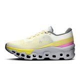 Women's On Cloudmonster 2 road running shoes in ivory and lime, limited edition, with cushioned soles and breathable mesh upper.